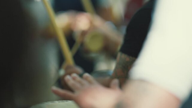 Capoeira musician playing berimbau in a roda
