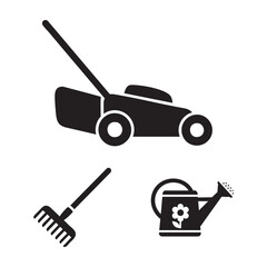 Fototapeta premium Garden maintenance lawnmower and rake set