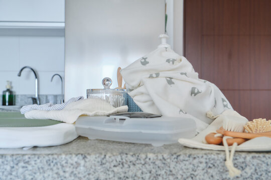 Essential baby care and hygiene items neatly arranged on a bathroom counter