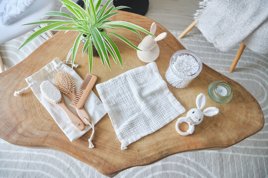 Eco-friendly baby essentials for hygiene and wellness on a wooden table