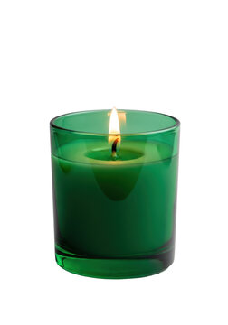 A minimalist scented candle in an emerald green glass jar with creamy white melted wax and a small golden flame, against a transparent studio background, conveying tranquility and luxury