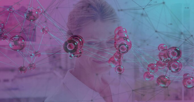 Posing scientist wearing white lab coat and specs behind 3D molecular net in lab, magenta-cyan glow