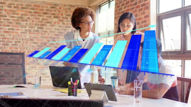 Team working in business meeting, woman pointing tablet causing bar chart growing analyzing data