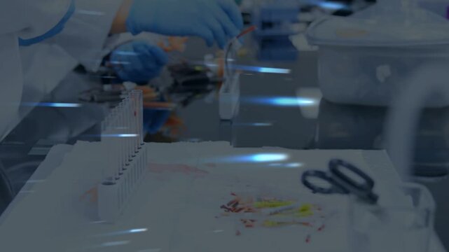 Blue-gloved hands entering from upper left, picking pipette and arranging tubes for sample prep