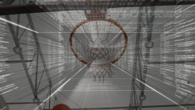 Male player raising ball and guiding shot through hoop in gym, sports overlay tracking ball path