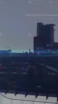 Vertical video: Sun sliding behind tower causing HUD panels sliding and waveform tracing city data