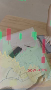 Vertical video: Planner reaching for tablet checking plan while overlaying finance charts for costs