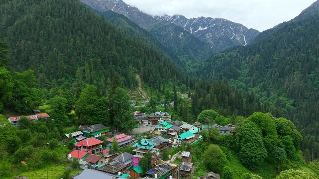 Aerial dolly in over Grahan village in lush Himalayan valley, India