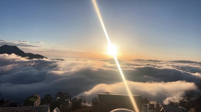 Cinematic sunrise timelapse with lens flare over a flowing sea of clouds and mountain ridges featuring small cabins in Sichuan China.