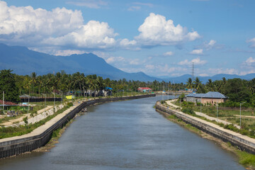 Fototapeta premium River Canal Through Tropical Landscape