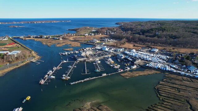 Aerial orbit over Cape Ann&rsquo;s Marina Resort harbor area filled with docked boats, Gloucester, Massachusetts, US