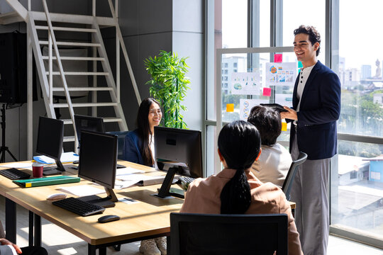 Team of young caucasian entrepreneur have small team meeting for project for marketing and sale management with skyscraper view for business startup and education