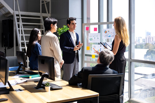 Team of young caucasian entrepreneur having a team meeting for project for marketing and sale management with skyscraper view for business startup and education