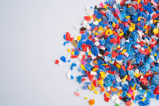 Plastic colorful pieces recycling shredded for industrial use.