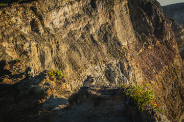 Obraz premium Beautiful morning in Kelimutu National Park, East Nusa Tenggara, Indonesia, with the view of the mountains, cliff, sunlight and blue sky