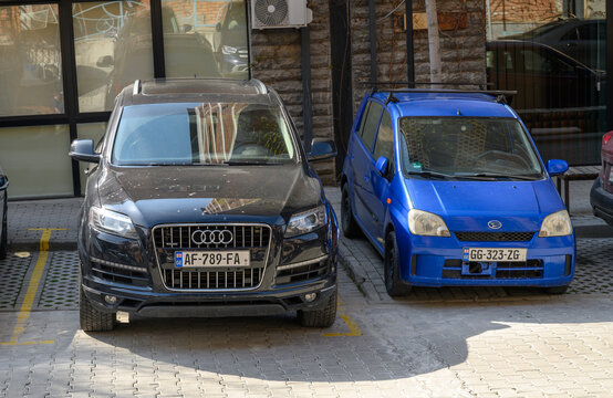  April 2, 2026, Tbilisi, Georgia Audi Q7 and Daihatsu Mira with Georgian license plates