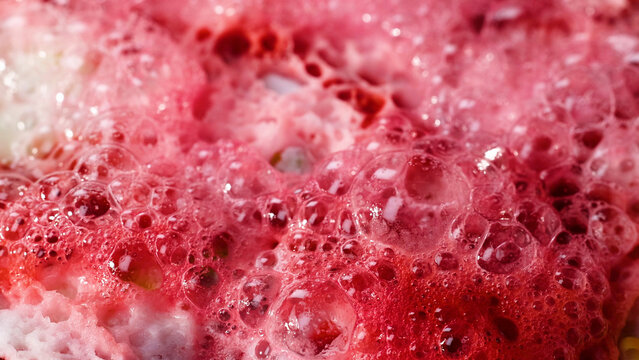 Macro View of Red and White Bubbling Chemical Reaction Foam