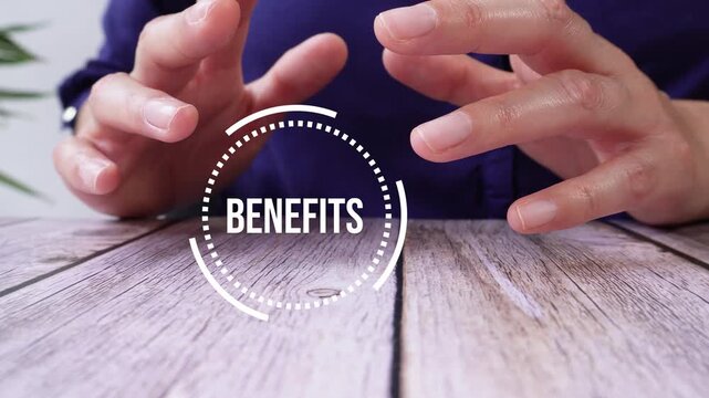 Hands gesture on a wooden table. A white circle highlights the word "Benefits." The fingers express openness and possibility. The image suggests positive results or value.