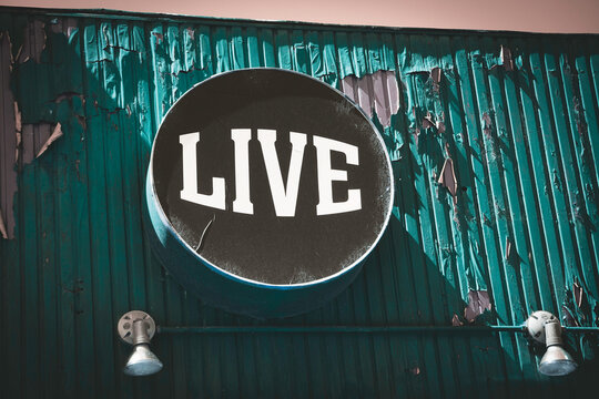 Vintage live sign on old building