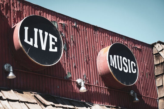 Vintage live music sign on building