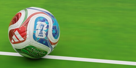 Fototapeta premium FIFA World Cup 2026 ball on green grass, football banner background for championship concept