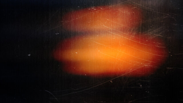 Abstract Rainbow Light Leak on Dark Grunge Background with Vintage Film Texture