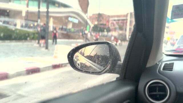POV of Car mirror on crowded road | Sun shining in the rear view side mirror | card side mirror while travelling in city