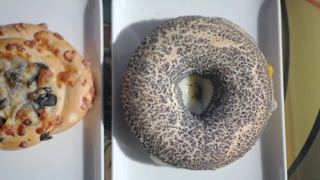 Enjoy fresh poppy seed bagel at local bakery