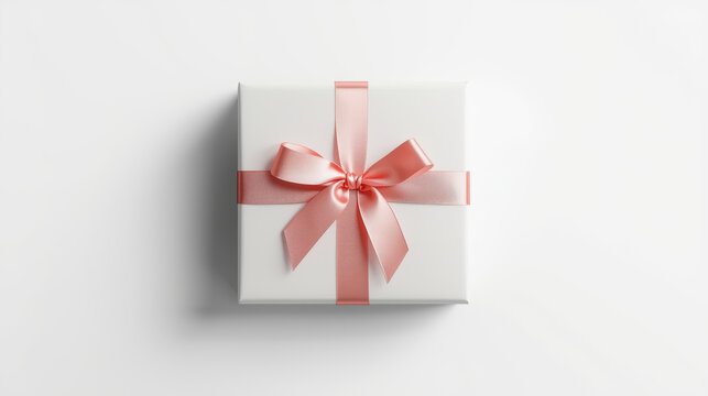 Elegant white gift box with soft pink satin ribbon and bow evoking gentle celebration