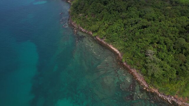 Verdant Forested Coastline Near Khlong Hin Beach On Koh Kood Island In Thailand. aerial shot
