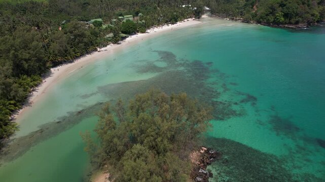 Khlong Hin Beach In Koh Kood, Thailand - Tropical Coastline With Clear Turquoise Waters And Coral Reef. aerial pullback shot