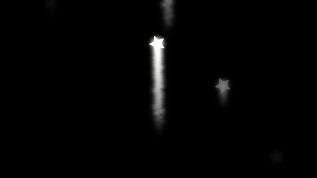 Monochrome animation of stylized stars falling with soft smoke trails against a dark backdrop. Suitable for magical themes, transitions, or overlay effects.