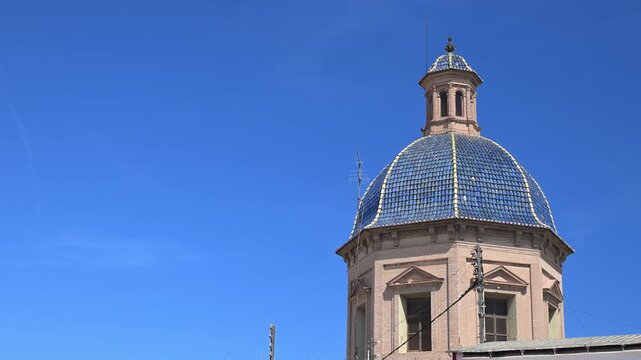 The baroque facade and pink domed roof of the historic sanctuary dedicated to the patron saint situated in the heart of the old town plaza