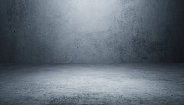 Empty concrete studio with textured wall and floor illuminated by overhead light