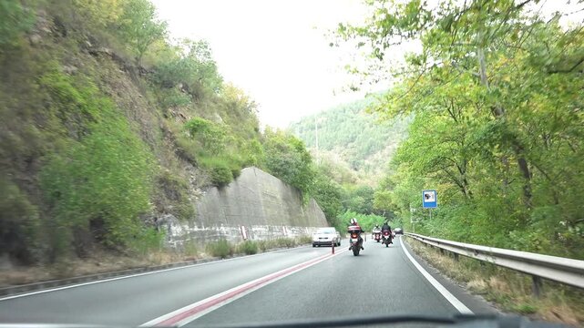 GREECE, AUGUST 20, 2023 Driving, Traffic Car on Highway, Roadway, Motorcycle, Motorbike Driver Traveling Pov