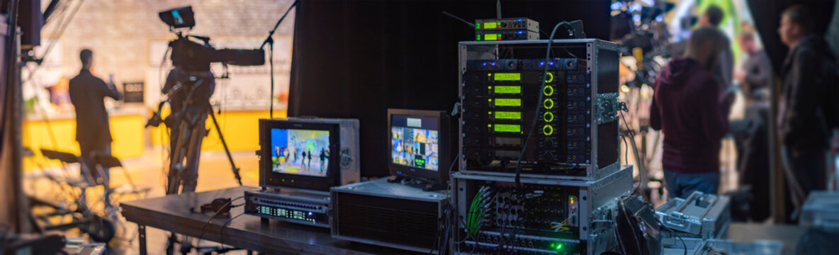 Professional Broadcast Control Room Setup with Server Racks and Staff with Copy Space