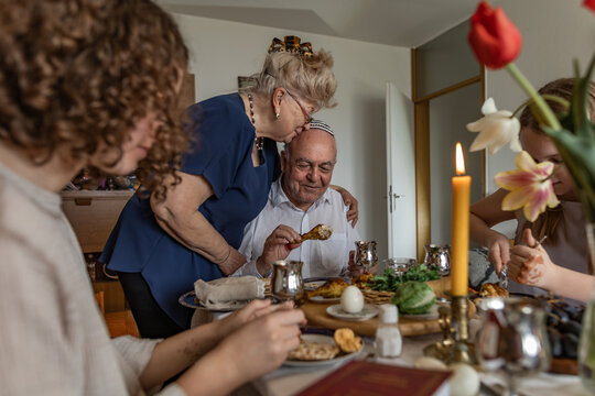 Grandparents and grandchildren celebrating Passover Seder at home