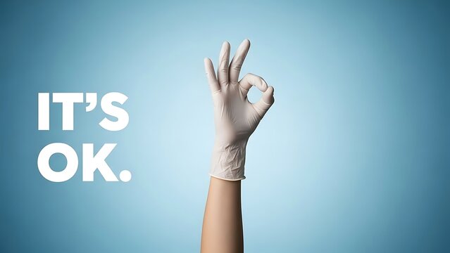 Hand in white glove giving ok sign with it's ok text on blue background
