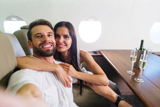 Wealthy couple traveling on luxury private jet