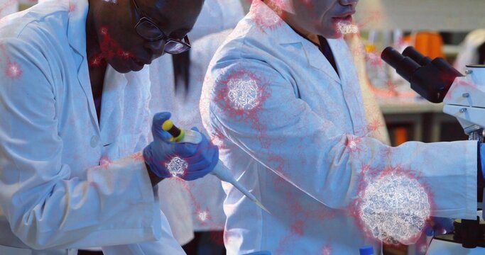 Pipetting scientist wearing white coat gloves moving sample at lab bench with pipette, microscope