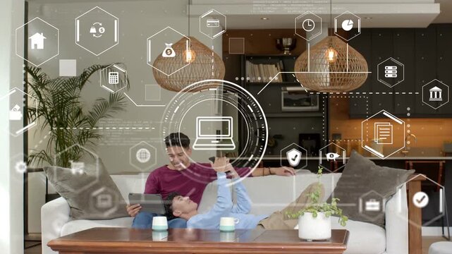 Lying man lifting phone, causing HUD hex icons rising, seated man leaning in and sharing tech