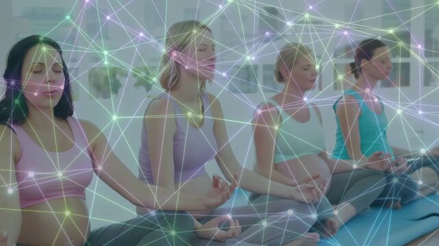 Four women meditating on blue mats prenatal focus, guided cue animating overlay, camera widening