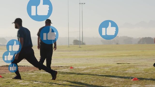 Coach signaling, athlete lunging through cones for fitness while blue likes covering left area