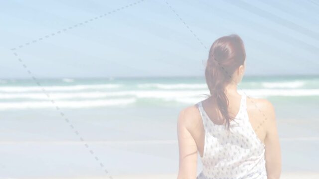 Woman straightening, turning to camera, stepping as dotted overlay skimming around woman for travel