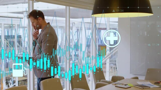 Man tapping tablet by glass, touching chin, causing waveform and car icons for business analysis