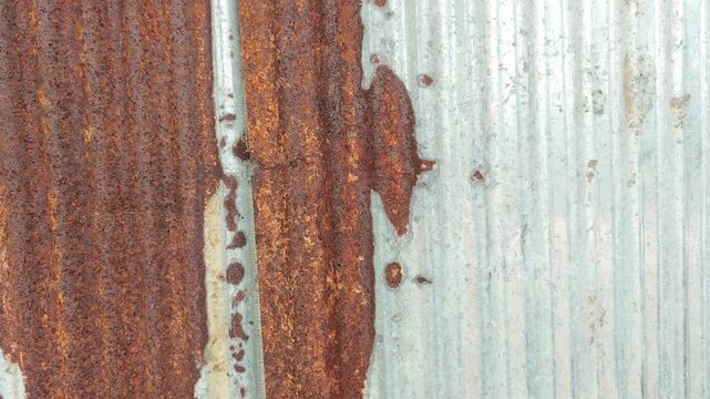 wall of rusty corrugated iron sheets