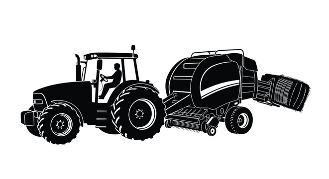 Silhouette of a modern agricultural tractor towing a hay baler machine while working in a field during the harvest season.