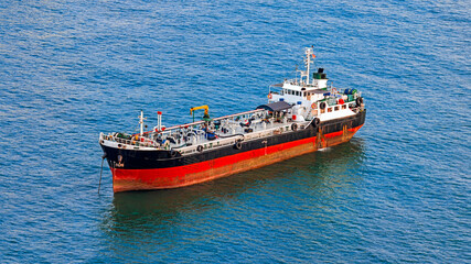 Fototapeta premium Aerial view commercial ships at sea.