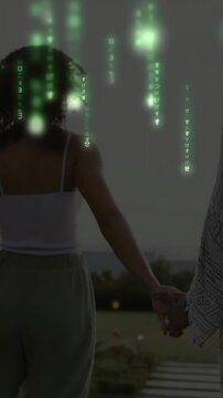 Vertical video: Two women holding hands walking path green rain starting midwalk showing bond tech
