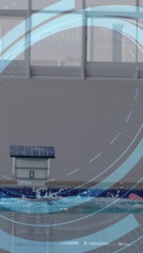 Vertical video: Swimmer surfacing and breaststroking in lane overlay obscuring swimmer for training